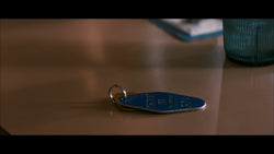 Memento Discount Inn Enamel Keychain