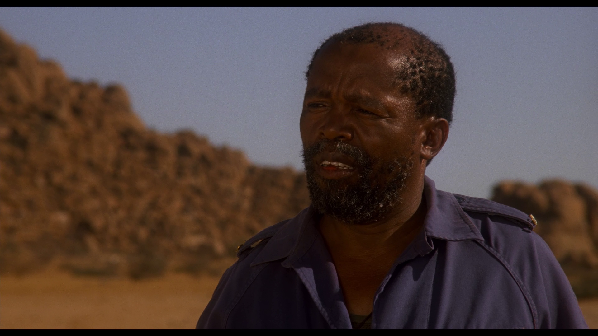 Still from Dust Devil (1992) 4K & Blu-ray T-Shirt Collector's Edition (+ Color Out Of Space)